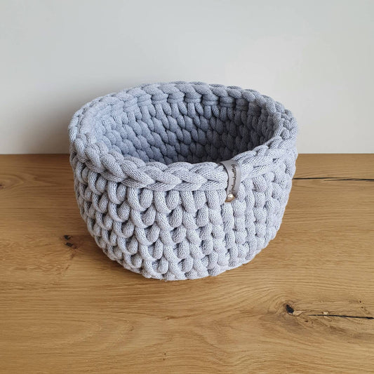 Storage cage crocheted in coarse knitting pattern